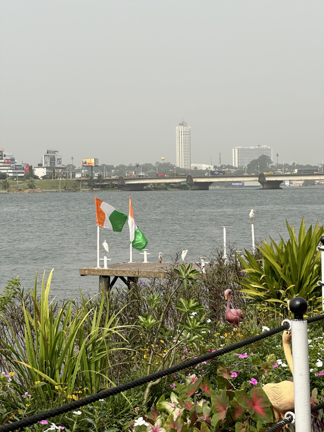 Lagoon landscape and urban horizon in West Africa.